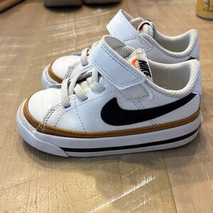 Nike Kids White and Black Sneakers with Gold Accents